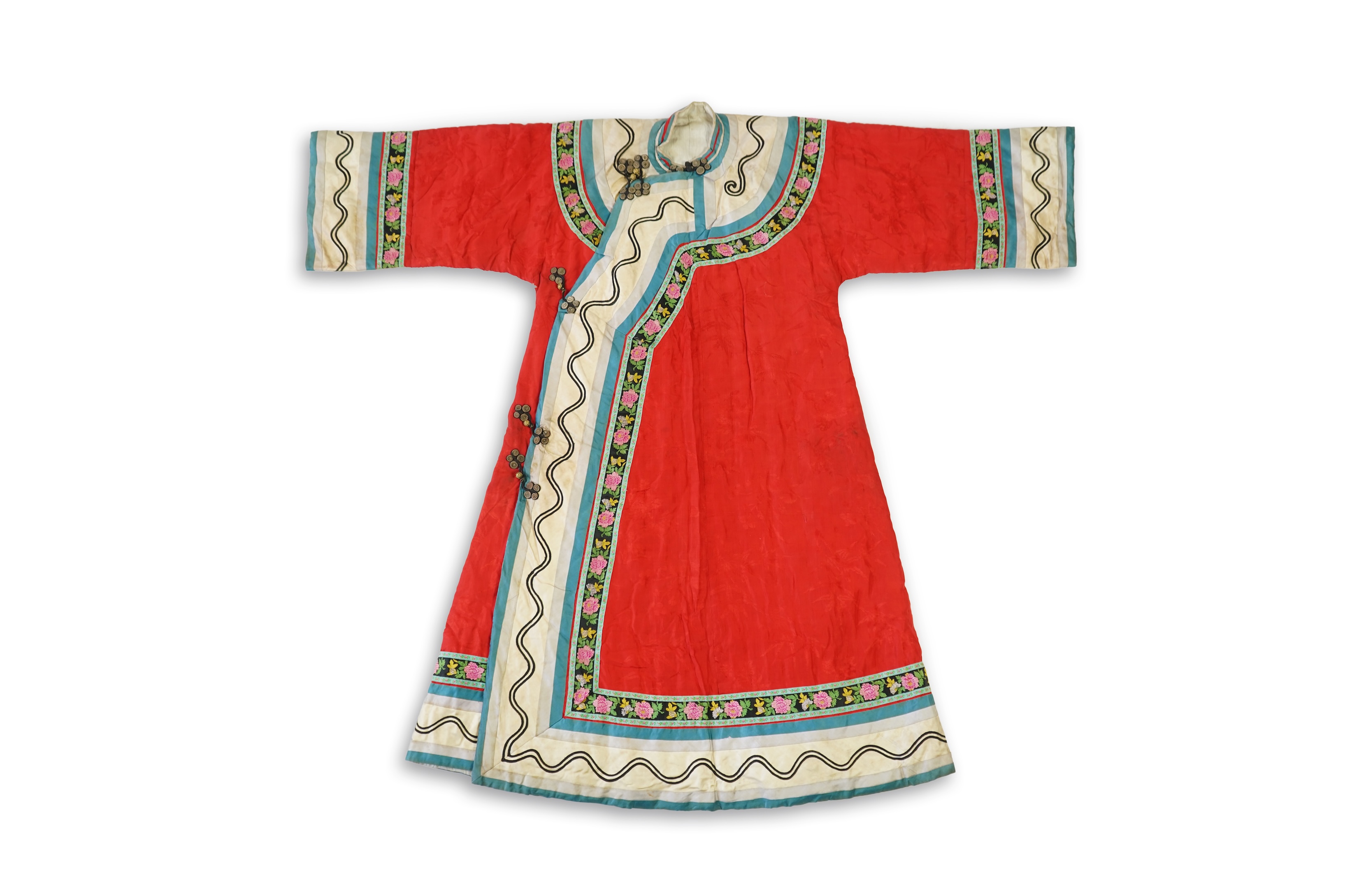 A late 19th century early 20th century Chinese red silk damask quilted Mandarin robe. Decorated with colourful rows braiding and ornate toggling. 116cm long. Condition - minor marks in places, may benefit from specialist